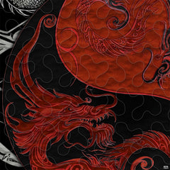 Close-up of ornate red dragon linework curling through a yin yang emblem