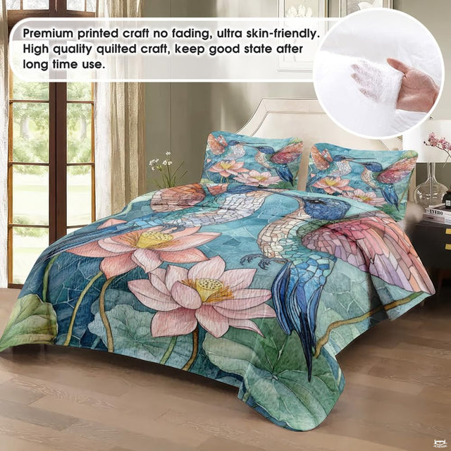 Close-up view of hummingbird bedding showcasing blooming lotus flowers and aqua turquoise tones