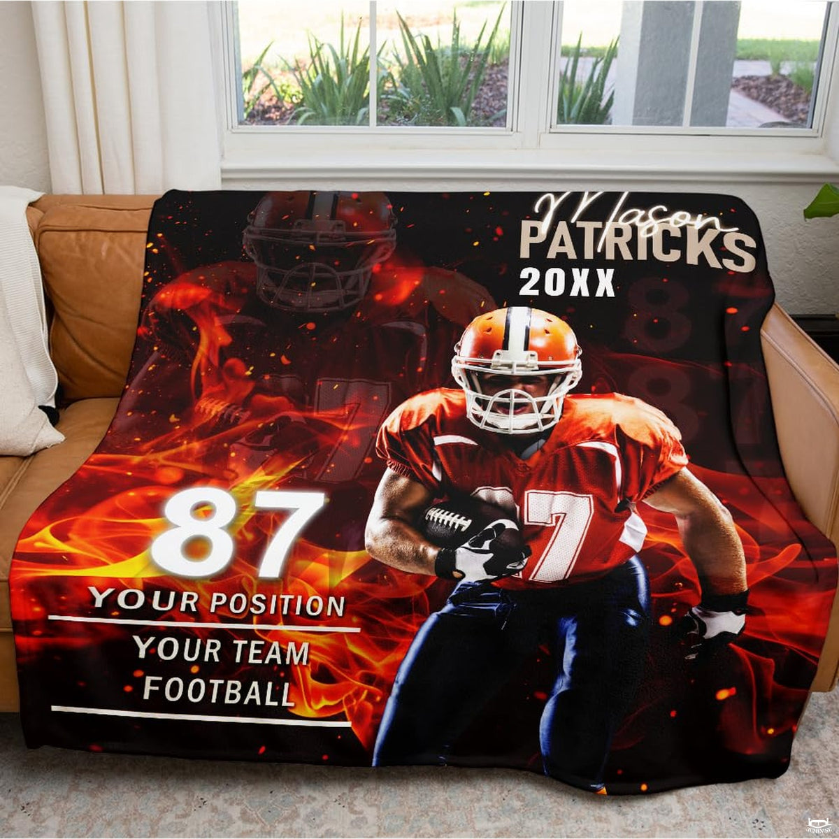 Fiery football player graphic throw blanket draped neatly across brown leather sofa in bright living room.