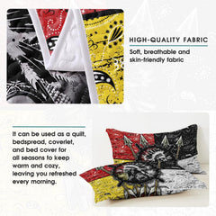 Bedroom setting featuring bold native american bedding with bandana motifs in red, yellow, and black.