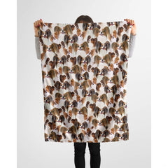 Papillon dog lover throw blanket styled across a couch in a bright living room.