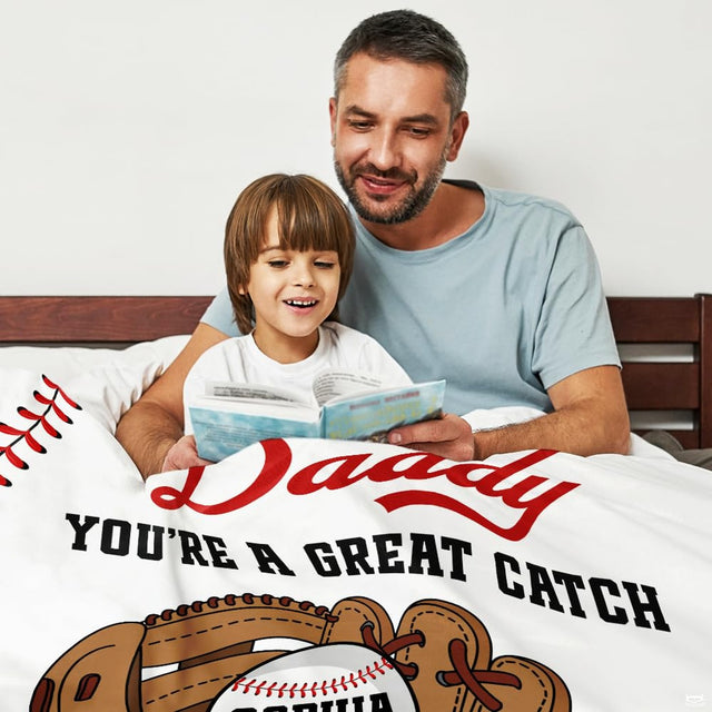 Living room display showing baseball mitt sports throw blanket styled over modern home furniture.