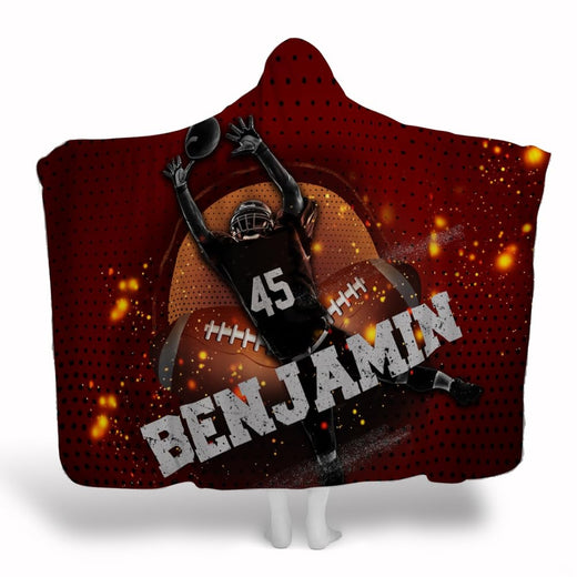 Football player crimson throw blanket depicting airborne receiver making catch amid glowing sparks