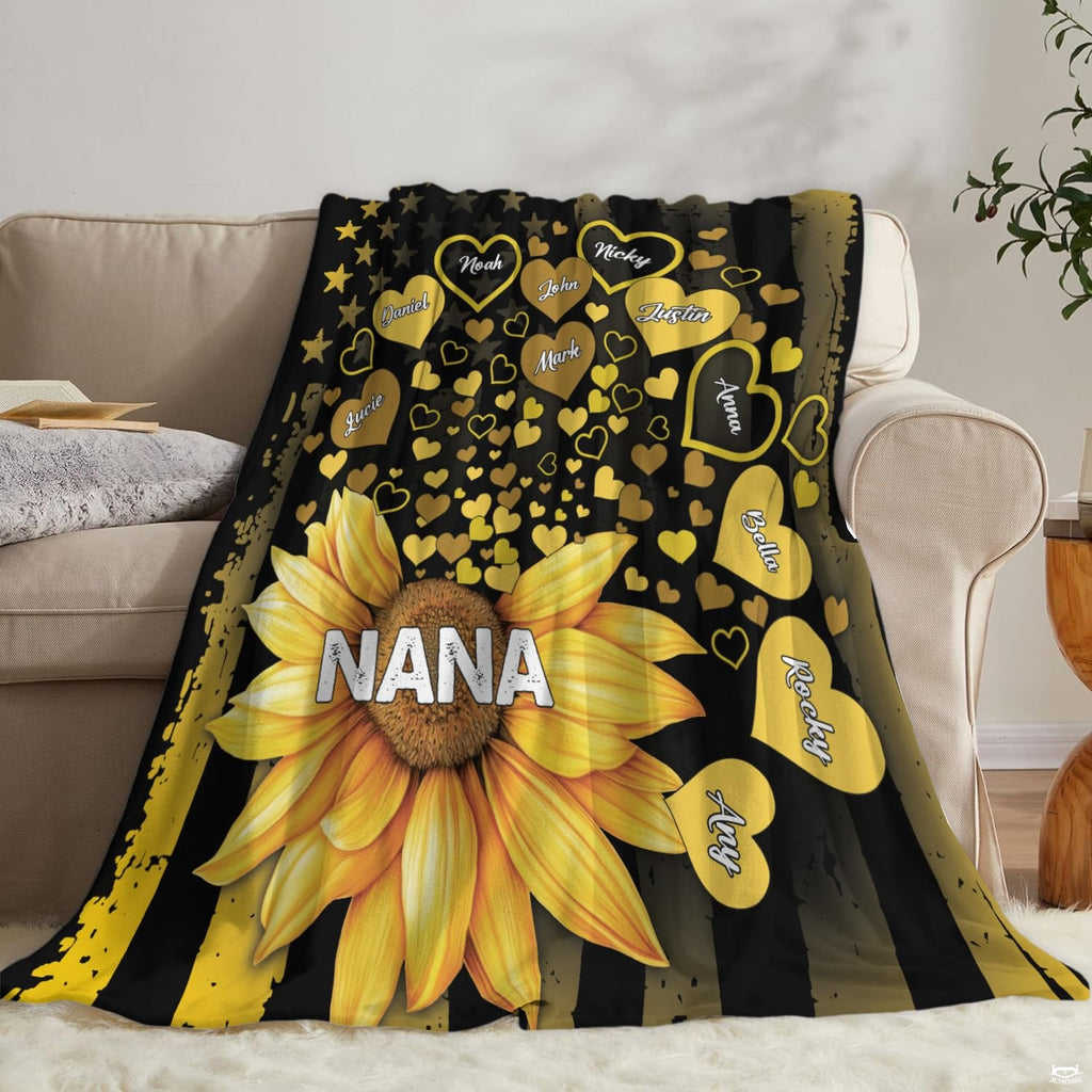 Living room sofa display showing the complete golden sunflower and flag print on neutral couch.