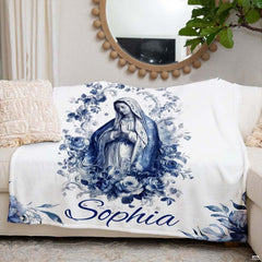 Interior decor presentation showing religious design draped on a white living room sofa with round mirror.