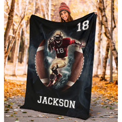 Folded athletic blanket highlighting football portal and white laces