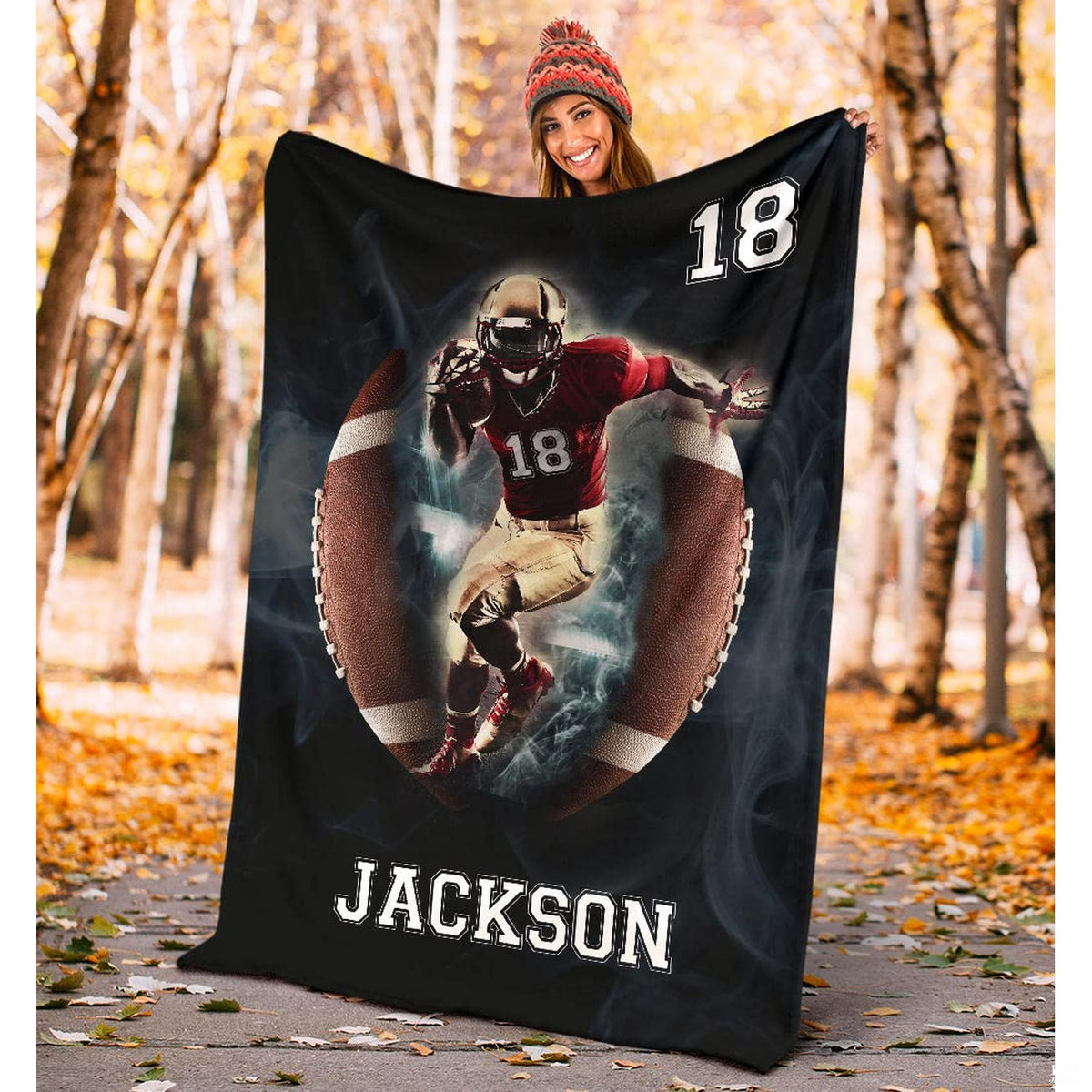 Folded athletic blanket highlighting football portal and white laces