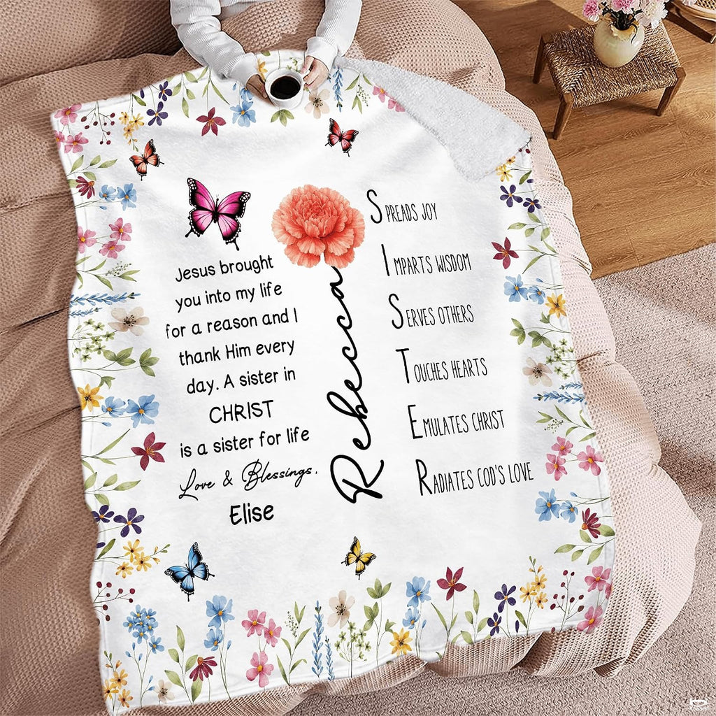 Wildflower floral blanket spread across seating area with beverage mug.