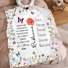 Wildflower floral blanket spread across seating area with beverage mug.
