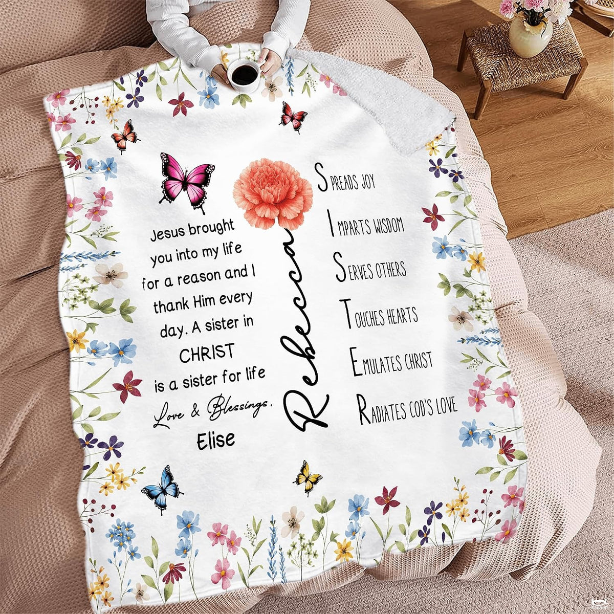 Wildflower floral blanket spread across seating area with beverage mug.