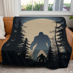 Nocturnal Bigfoot forest blanket styled over a living room couch.