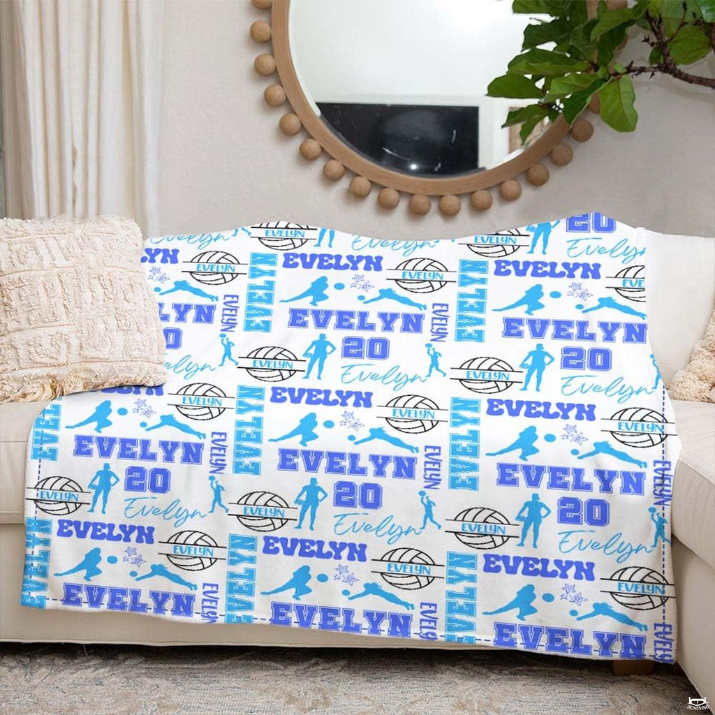 Graphic pattern close-up of sky blue volleyballs and dark star accents.