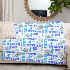 Graphic pattern close-up of sky blue volleyballs and dark star accents.