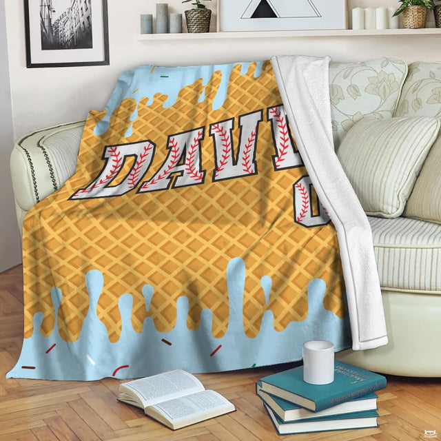 Waffle ice cream sandwich bedding with melting light blue frosting, rainbow confetti sprinkles, and athletic print.