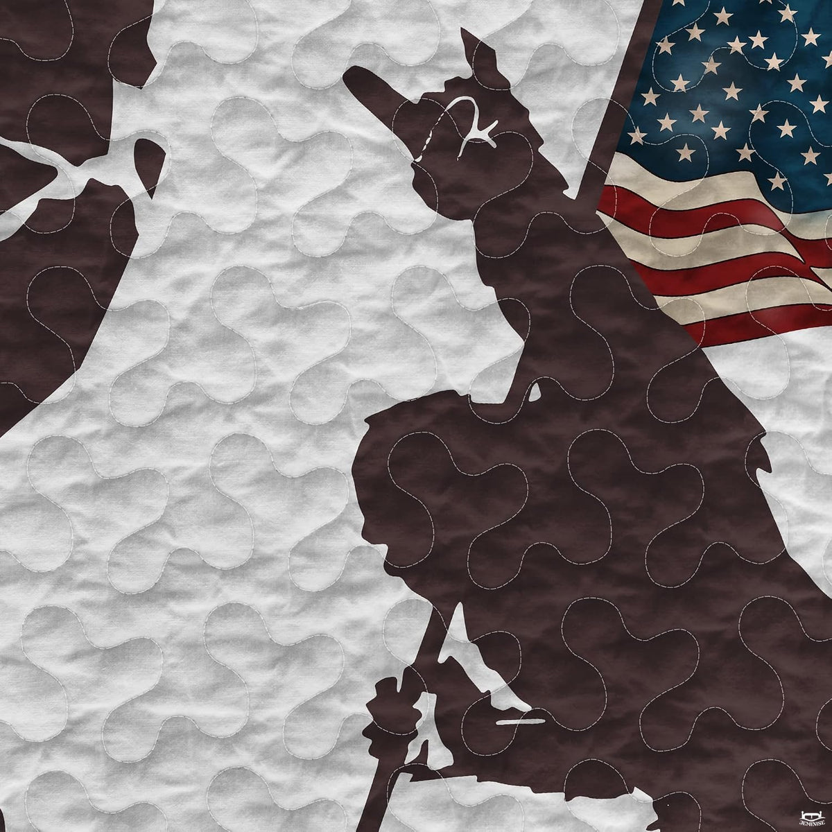Close-up perspective of Bigfoot bedding detailing distressed flag stripes, pine tree foliage, and silhouette art
