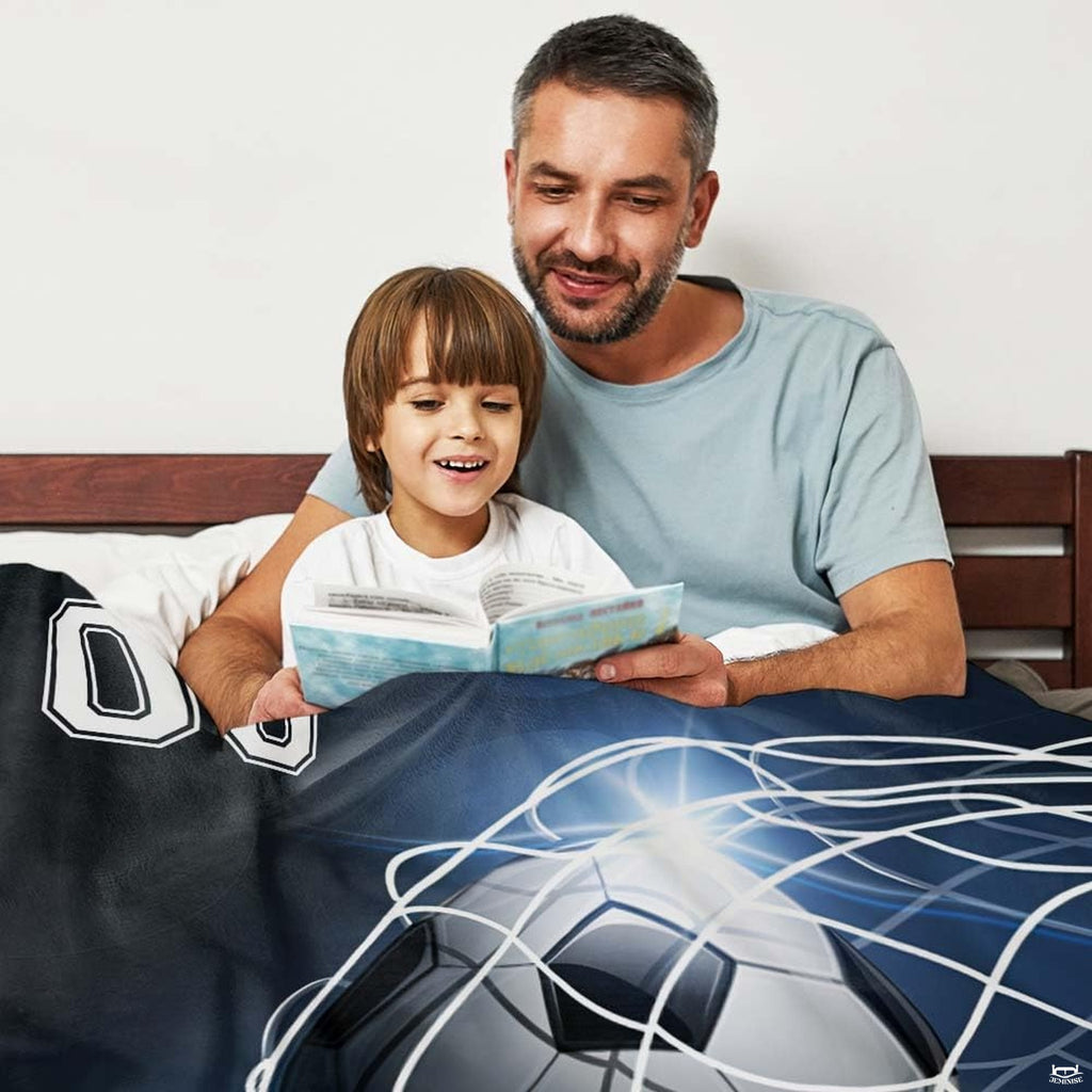 Soccer ball in net artwork blanket folded on living room chair