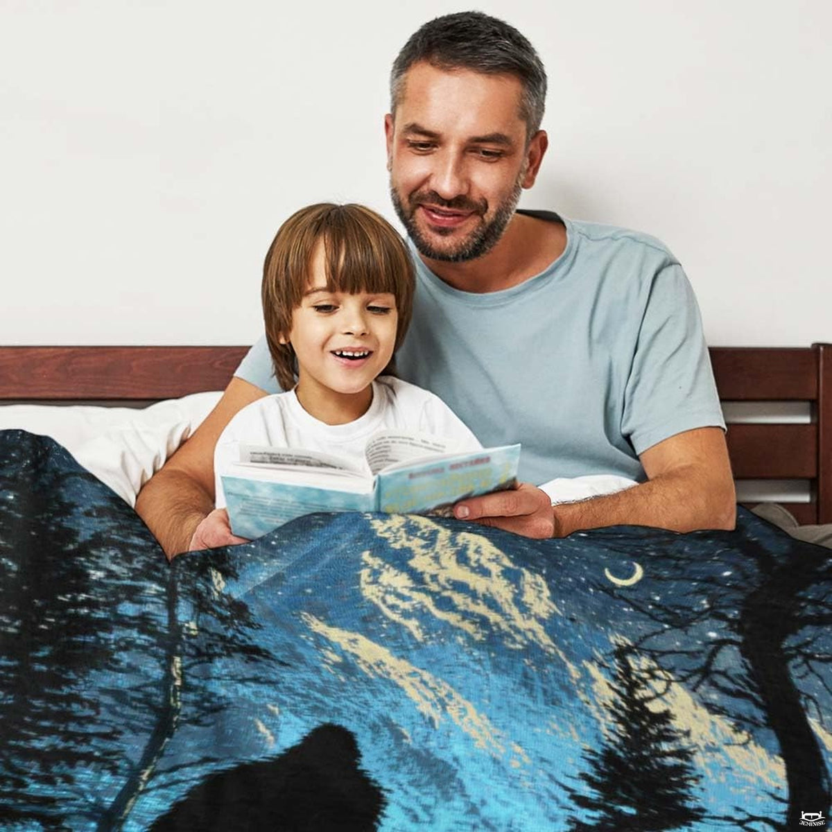 Detailed close-up of the printed Bigfoot silhouette and turquoise celestial graphic on the throw blanket