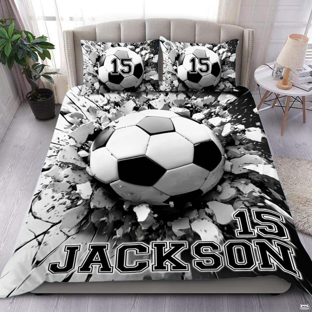 Soccer bedding displaying 3D soccer ball bursting through shattered concrete fissures on monochrome background