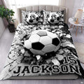 Soccer bedding displaying 3D soccer ball bursting through shattered concrete fissures on monochrome background
