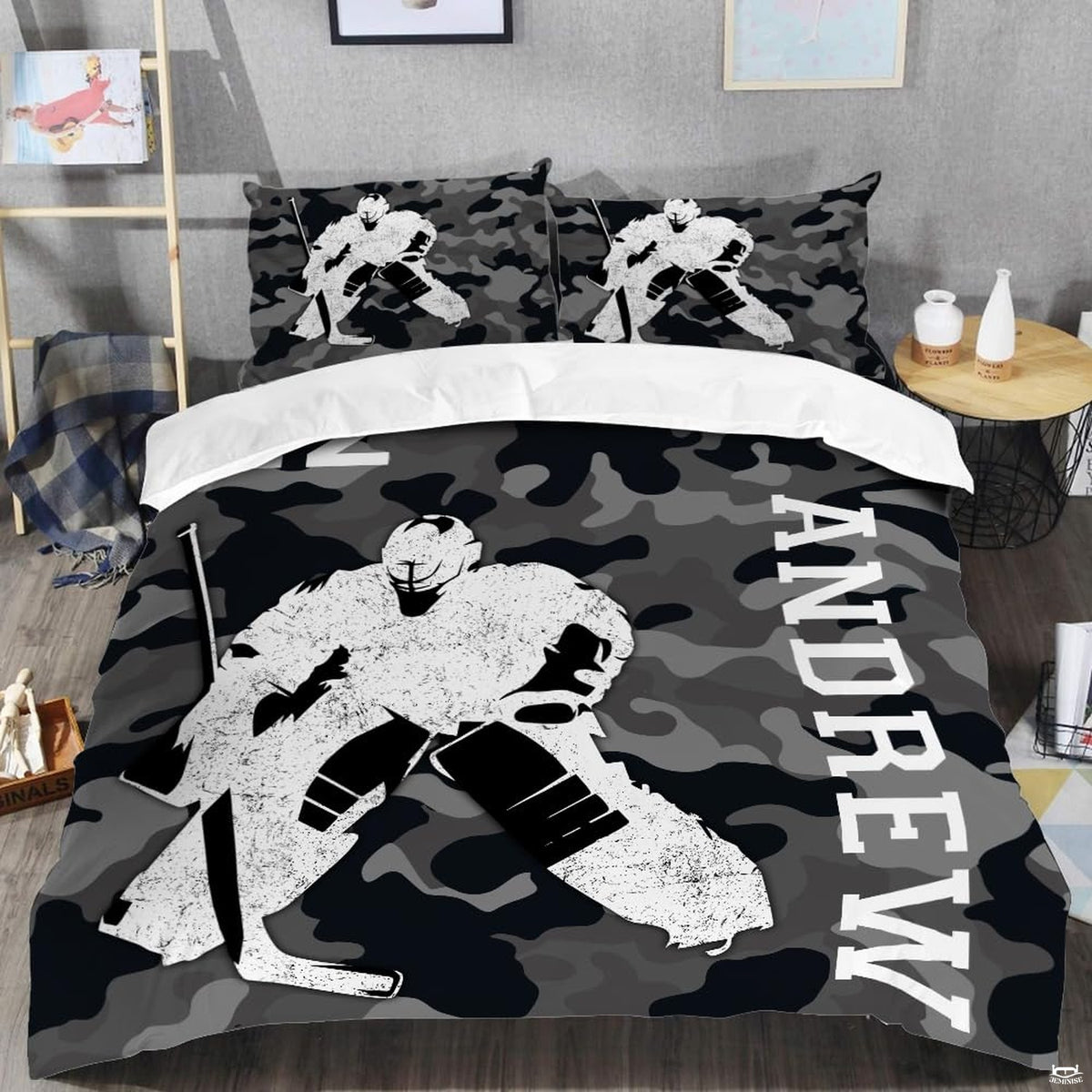 Top-down view of arctic camo ice hockey bedding set arranged neatly on a youth bedroom mattress