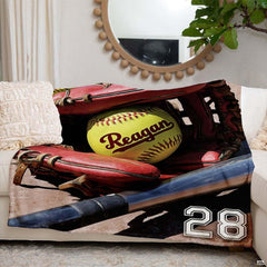 Red glove fastpitch artwork blanket styled across modern couch