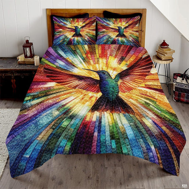 Green blue hummingbird with spread wings over multicolored radial strips