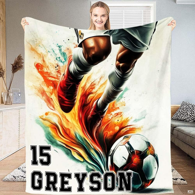 Watercolor soccer kick splash athletic art blanket held up by woman