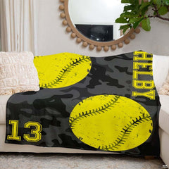 Camo softball artwork blanket styled across modern couch sofa