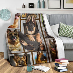 Grey couch arrangement featuring the German Shepherd blanket draped beside patterned pillows.