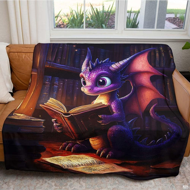Detail of cute fantasy dragon artwork with large expressive eyes and bat-like wings on bedding.