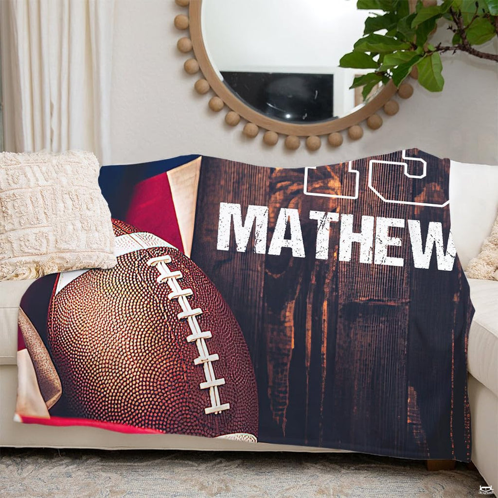 Close-up view of football illustration with white laces and draped stars and stripes print.