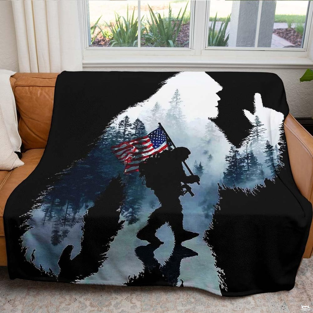Patriotic Bigfoot throw blanket folded neatly showing white plush interior lining