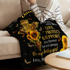 Detail of golden yellow sunflowers, shimmering stardust, and devotional lettering on a blanket