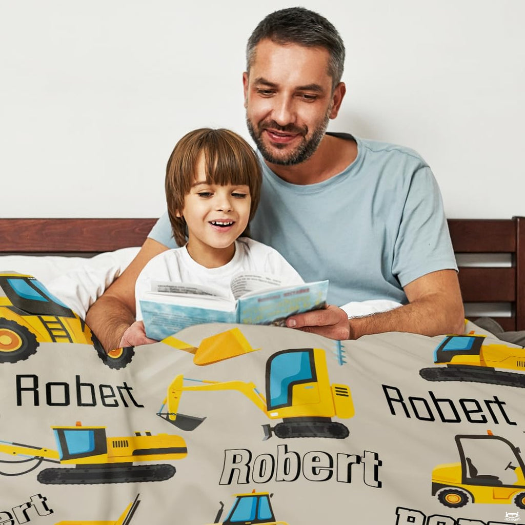 Youth bedroom styling featuring the dynamic excavator bed sheets pattern and machinery artwork.