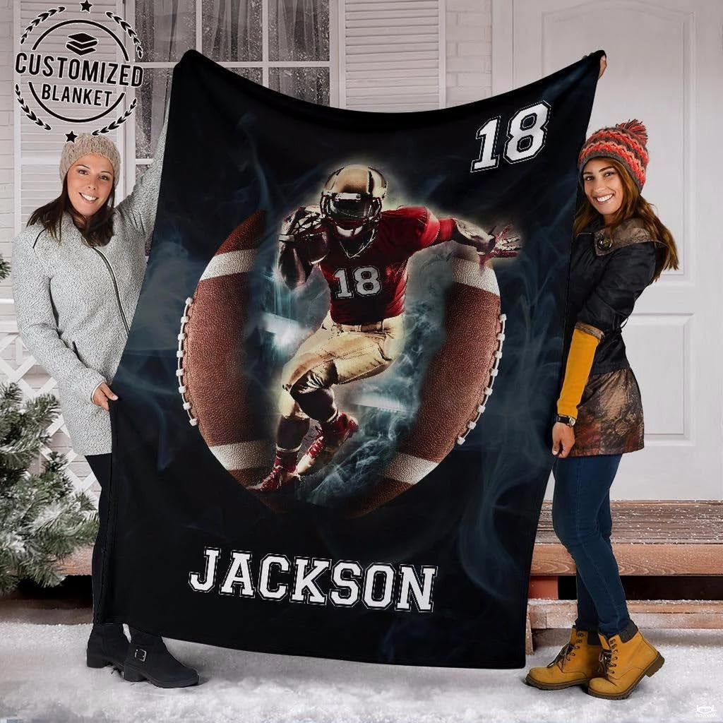Close view of charging football runner in helmet on graphic blanket