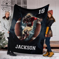 Close view of charging football runner in helmet on graphic blanket