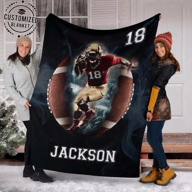 Close view of charging football runner in helmet on graphic blanket