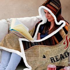 Library bookshelf throw blanket arranged neatly on a bed in a modern room