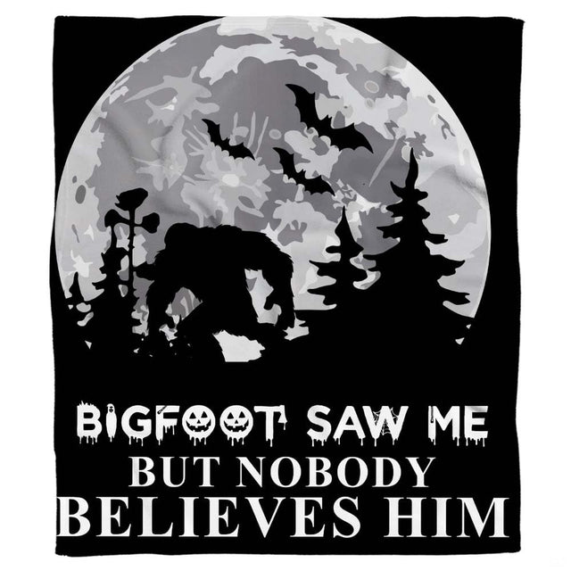 Spooky Bigfoot blanket display showing the crouching Sasquatch silhouette, full moon, and flying bats.