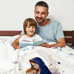 Bed presentation highlighting the peaceful floral Madonna and Child devotional blanket.