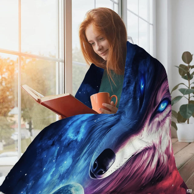 Overhead view of galaxy wolf bed sheets featuring glowing wolf eyes and vibrant interstellar clouds.