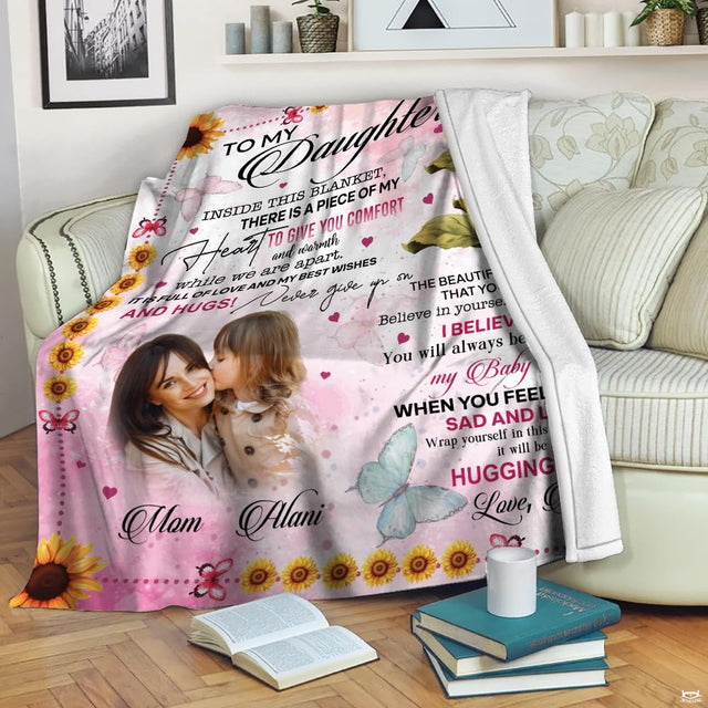 Sunflower daughter throw blanket view 2 highlighting sunflower blooms, butterflies, and pastel pink background