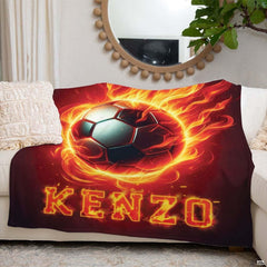 Flaming soccer sports textile draped over living room sofa