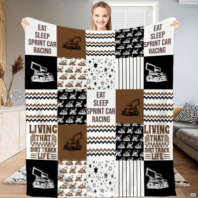 thematic accent thematic accent thematic accent bedding set showing checkered flags and race cars in brown and black tones.