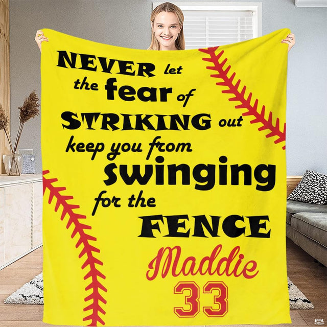 Close up macro view of inspirational softball throw blanket highlighting fabric texture and sharp red print