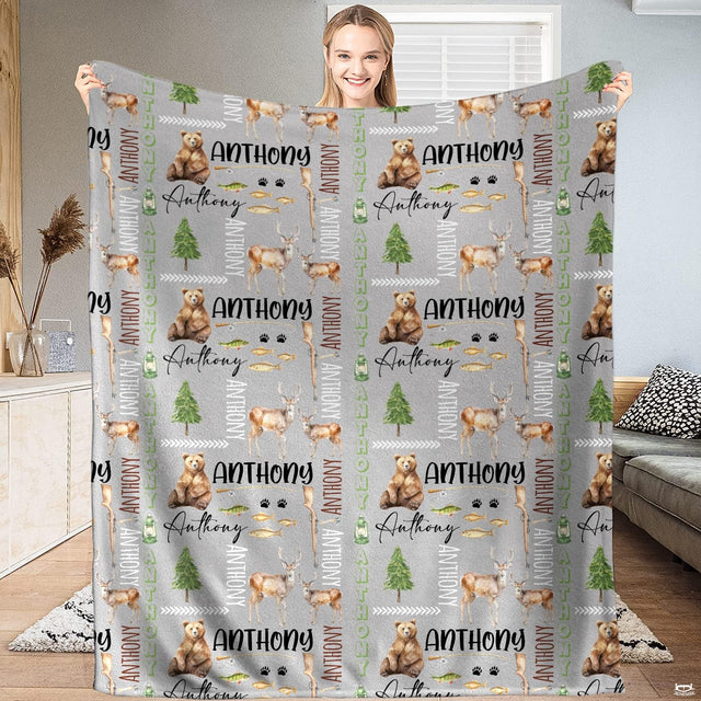 Rustic outdoor daybed decor showcasing woodland bear, hunting rifle, and pine tree motifs in neutral tones.