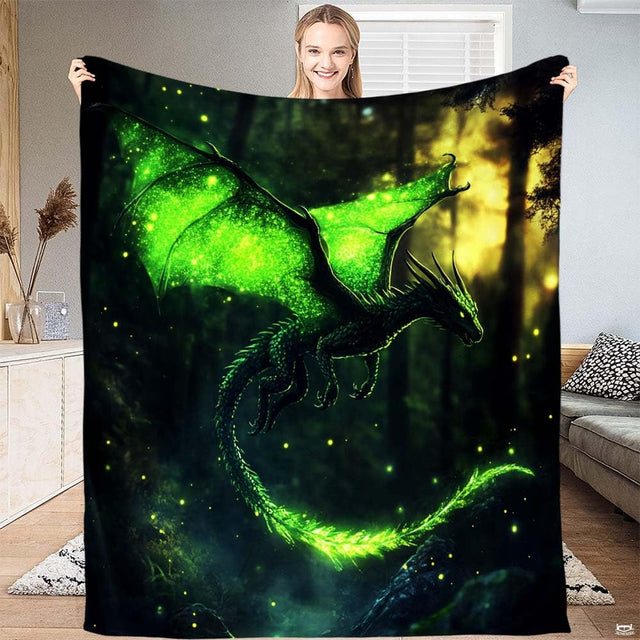 Close-up view of bioluminescent dragon throw blanket highlighting glittering lime wings and firefly details.