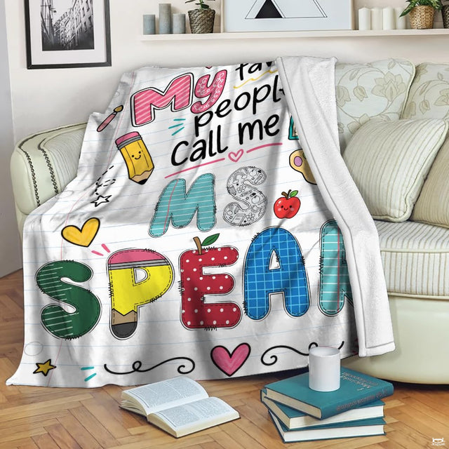 Close-up of colorful patchwork lettering and cute stationery doodles on school theme bedding.