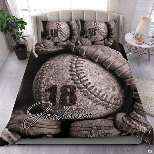 Baseball bedding displaying weathered antique baseball resting in fielding mitt palm over dark charcoal background