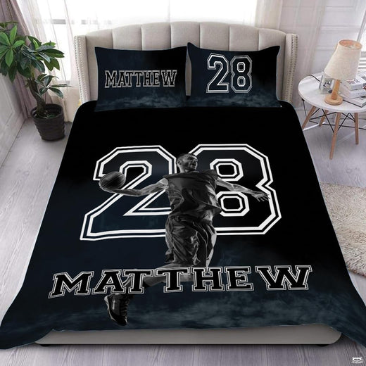 Monochrome basketball player bedding featuring airborne athlete and varsity jersey numbering on a black bed